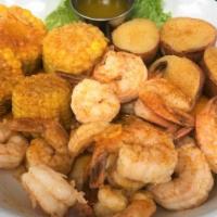Cajun Shrimp Boil · Our large shrimp boiled in bombshells own Cajun crawfish seasoning. Served with corn and pot...