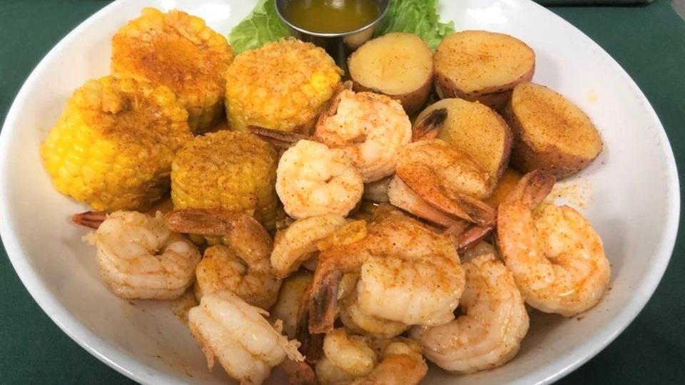 Cajun Shrimp Boil · Our large shrimp boiled in bombshells own Cajun crawfish seasoning. Served with corn and potatoss.