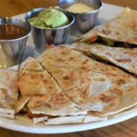 Veggie Quesadillas · A flour tortilla filled with peppers, onions and lots of cheddar cheese, grilled to perfection