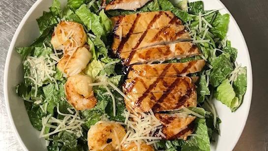 Caesar Salad · Romaine lettuce, Parmesan cheese and croutons. Tossed in Caesar dressing.