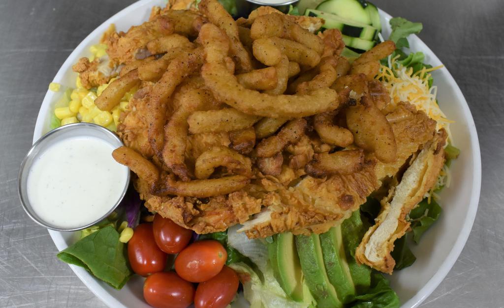 The Bombshell · BBQ ranch chicken salad lettuce, tomatoes, corn,black beans and fresh cucumbers with our BBQ ranch dressing. Then we top off with grilled or fried chicken, avocado and fried onion straws.