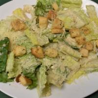 Dinner Caesar Salad · Romaine lettuce, Parmesan cheese and croutons tossed in Caesar dressing.