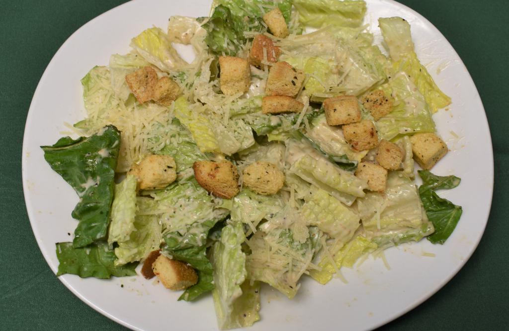 Dinner Caesar Salad · Romaine lettuce, Parmesan cheese and croutons tossed in Caesar dressing.
