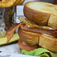 Uncle Spam · Grilled Spam served on a triple decker Sandwich. Toped with American cheese, lettuce and tom...