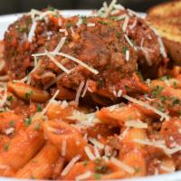 Paratrooper Pasta · Slow cooked meat sauce with beef and Italian sausage, penne pasta topped with homemade meatb...
