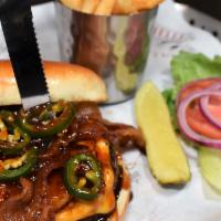 Pearl Harbor Burger · Served with bacon, jalapenos, pineapple, lettuce, tomato, onion and our sweet n spicy BBQ sa...