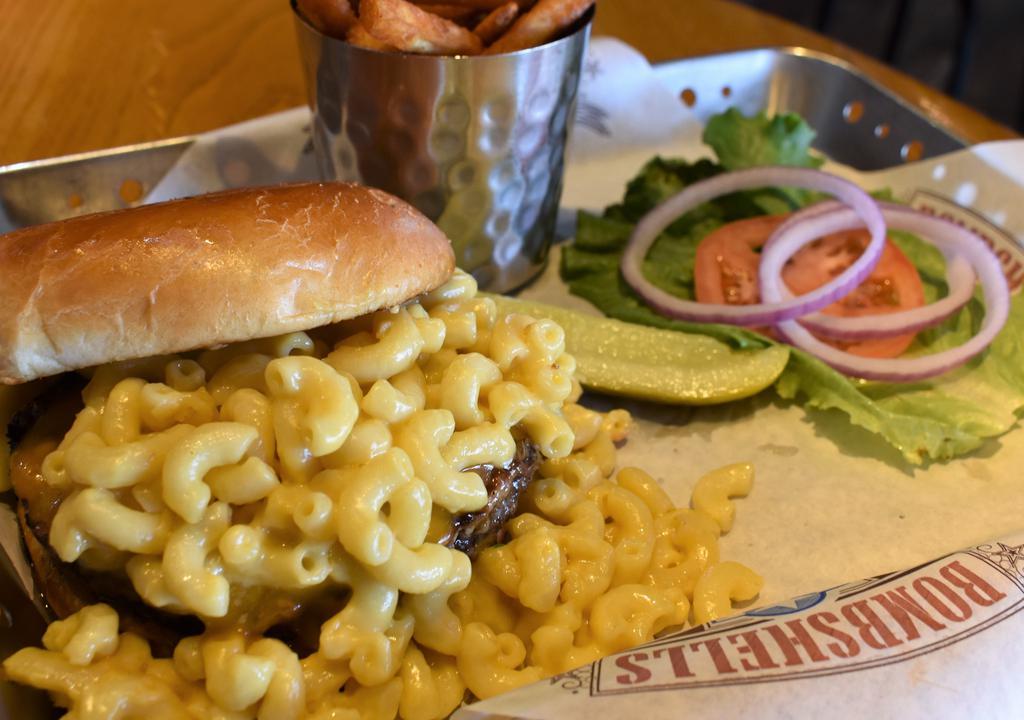 The Mac Burger · Homemade mac and cheese piled high on our Angus burger, topped off with more cheddar cheese.