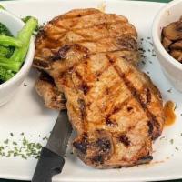 The Porkchop Express · 2 center cut pork chops grilled, blackened or fried to perfection. Served with your choice o...