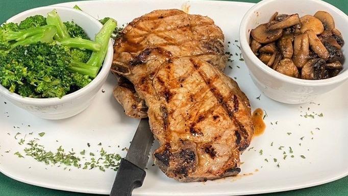 The Porkchop Express · 2 center cut pork chops grilled, blackened or fried to perfection. Served with your choice of sides.