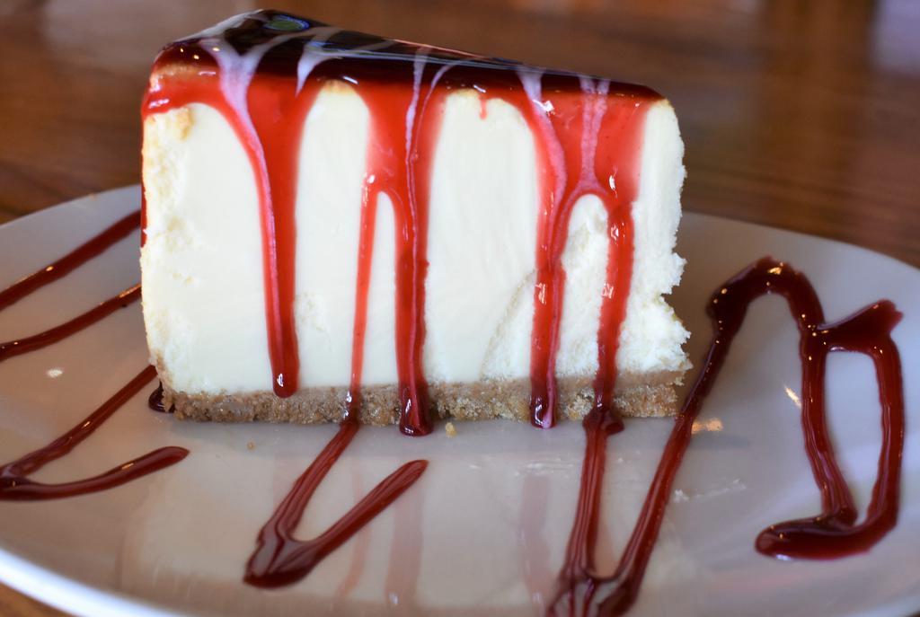 Cheesecake · Cheesecake topped with chocolate, caramel,or strawberry sauce.