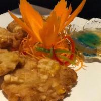 Corn Tod (4) · Battered, Thai spices and corn kernel patties.