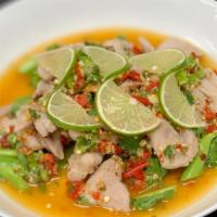 Moo Ma Nao · Pork tenderloin  with lime garlic, chili and Chinese broccoli.