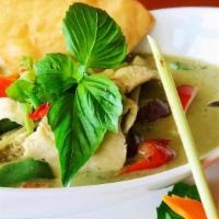 Green Curry · Green curry paste, coconut milk, eggplant, bamboo shoots, bell papper and fresh basil leaves.