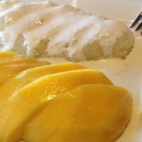 Mango Sticky Rice · Mango slices and steamed sweet rice. Smothered with coconut sauce.