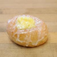 Cream Top Glazed Donut · Glazed donut topped with bavarian cream and powdered sugar