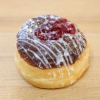 Chocolate Raspberry Donut · Chocolate glazed donut topped with raspberry filling and powdered sugar