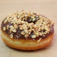 Fancy Donut · Chocolate glazed donut with your selection of rainbow sprinkle, coconut, peanut, or cinnamon...