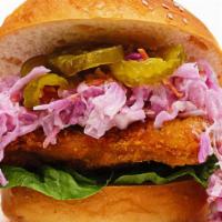 Crispy Chicken Sandwich · fried chicken thigh with house made garlic aioli, coleslaw, lettuce, and pickles on a toaste...