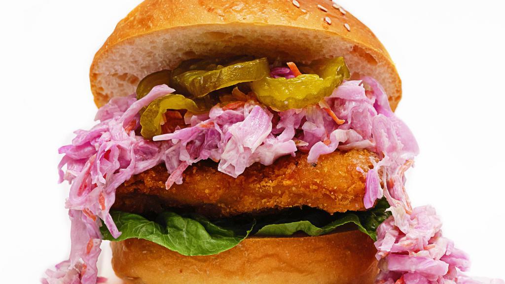 Crispy Chicken Sandwich · fried chicken thigh with house made garlic aioli, coleslaw, lettuce, and pickles on a toasted brioche bun