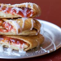 Cherry Strudel · Our homemade strudel stuffed with delicious cherry pie filling and cinnamon mixture topped w...