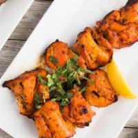 Chicken Bihari Kabab · Barbecued thin slices of boneless chicken marinated in fresh herbs.
