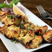 Chicken Malai Kabab · Barbecued slices of chicken breast marinated in mild spices.