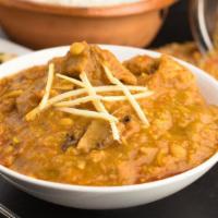 Daal Gosht · Goat meat prepared in a mix of lentils and stewed with cumin and fresh spices.