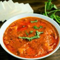 Paneer Tikka Masala · Homemade cubed paneer simmered in a creamy tomato sauce and spices.