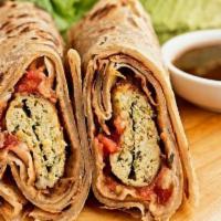 Chicken Kabab Roll · Chicken Kabab wrapped in a fresh bread of your choice and served with tamarind chutney and r...