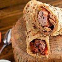 Beef Kabab Roll · Beef Kabab wrapped in a fresh bread of your choice and served with tamarind chutney and raita.