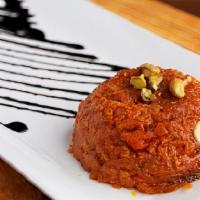 Gajar Halwa · Carrots cooked in milk seasoned with green cardamom and served with pistachio nuts and almon...