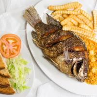 Mojarra Frita · Fried mojarra served with French fries and rice. (Lettuce, Tomatoes, Avocados).