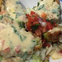 Stuffed Avocados · Two avocado halves stuffed with cheddar cheese, shredded chicken, deep fried and topped with...