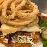Bbq Pulled Pork Sandwich · Pulled pork, shaved cabbage, tomatoes, Swiss cheese, bbq sauce and topped with fried onion s...