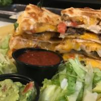Double Stacked Quesadillas · Large flour tortillas filled with fajita chicken and steak, Pepper Jack cheese, Cheddar and ...