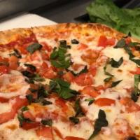 Margherita · Crushed tomato sauce and diced tomatoes with fresh garlic, fresh basil, Mozzarella and Parme...