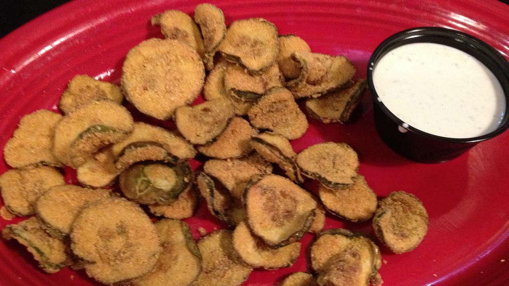 Fried Pickles · Dill pickle chips battered with corn meal and deep fried to a golden brown.