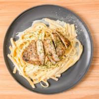 Chicken Fettuccine Alfredo · fettuccine noodles tossed in our house made alfredo sauce topped with our spiced grilled chi...