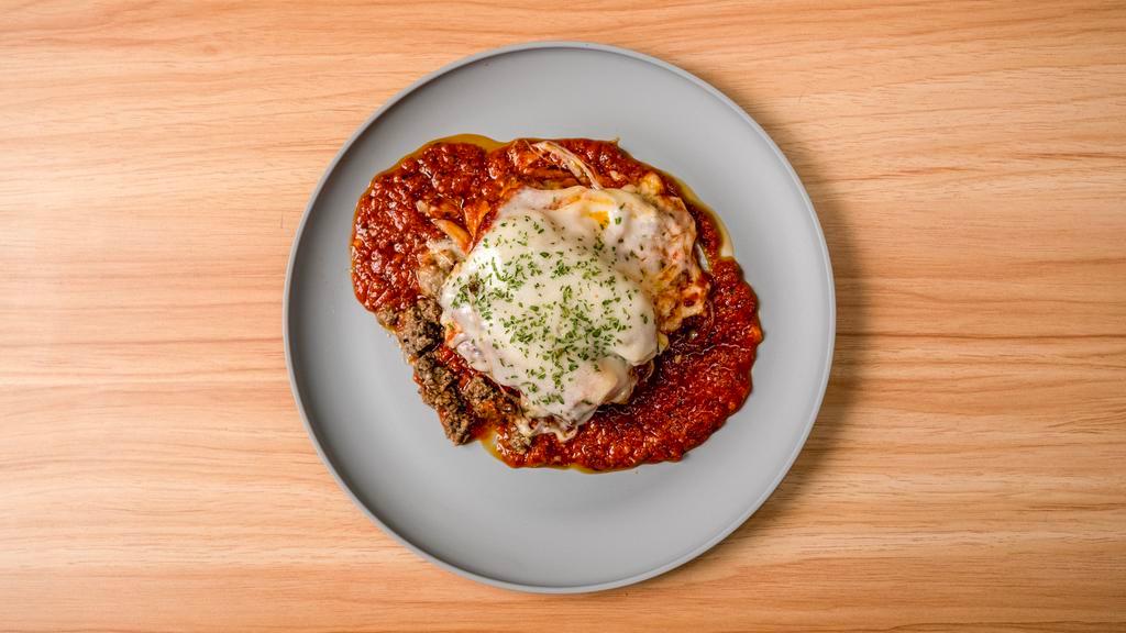 Homemade Lasagna With Ground Beef · Our homemade lasagna stuffed with house made ground beef , house made italian sausage ricotta cheese parmesan cheese and mozzarella cheese topped wit marinara sauce and provolone cheese.