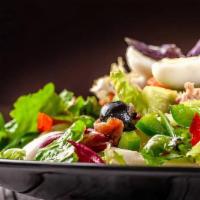 Leonardo'S Italian Salad · Leonardo's tossed iceberg lettuce with pepperoncini peppers, black olives, grated Parmesan a...