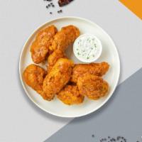 Charlie Mango Habanero Wings · Fresh chicken wings breaded, fried until golden brown, and tossed in mango habanero sauce. S...