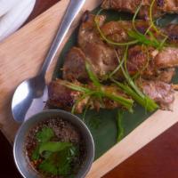 Moo Yang (4 Pcs) · Traditional Thai style grilled pork on the skewer, seasoned with garlic and our house-specia...