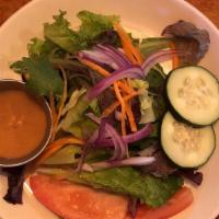 House Salad · Lettuce, tomato, onions, cucumber, carrot, served with special house-made dressing.