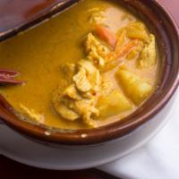Yellow Curry · Southern Thai style yellow curry paste in coconut milk with cube potato, onions and carrot.
