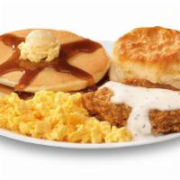 The Morning Classic · Two hotcakes with syrup, scrambled eggs, breakfast steak with gravy and a biscuit.