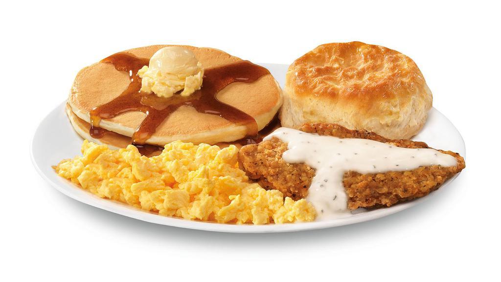 The Morning Classic · Two hotcakes with syrup, scrambled eggs, breakfast steak with gravy and a biscuit.