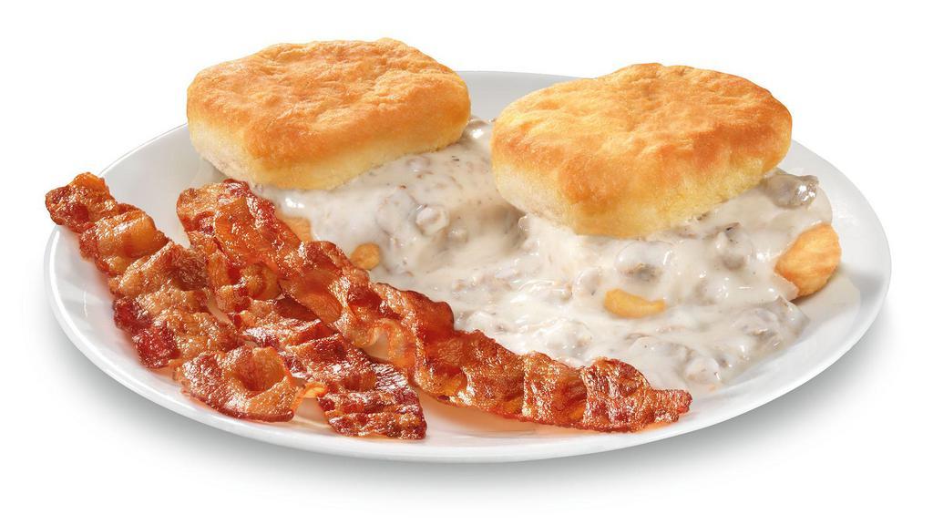 Biscuits & Gravy · Two biscuits with sausage gravy and your choice of one meat (three-pieces of bacon, sausage patty, or breakfast steak).