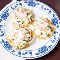 Sopes · Hand-Made Cripy Tortilla shell Topped with Beans, Choice of Meat, Lettuce, Tomatoes, Sour Cr...