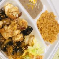 Camarones Al Mojo De Ajo · 8 Jumbo Grilled Shrimp, grilled mushrooms sauté to perfection in minced garlic sauce, served...