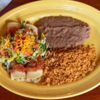 Tacos Rancheros · Two soft rolled corn tortillas stuffed with beef or chicken, topped with salsa ranchera, let...